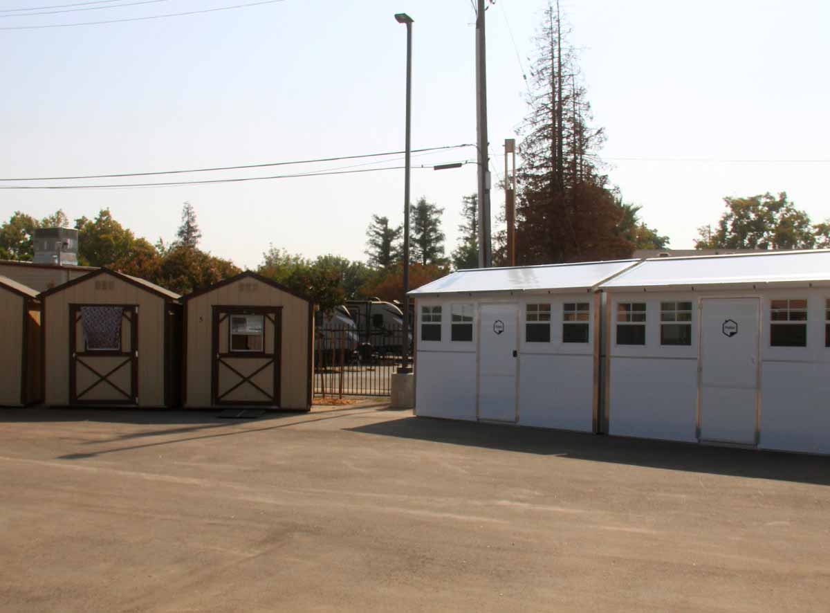 The original structures are replaced with new pallet shelters to house 65 men & women nightly.